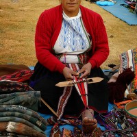 female weaver in market in Peru